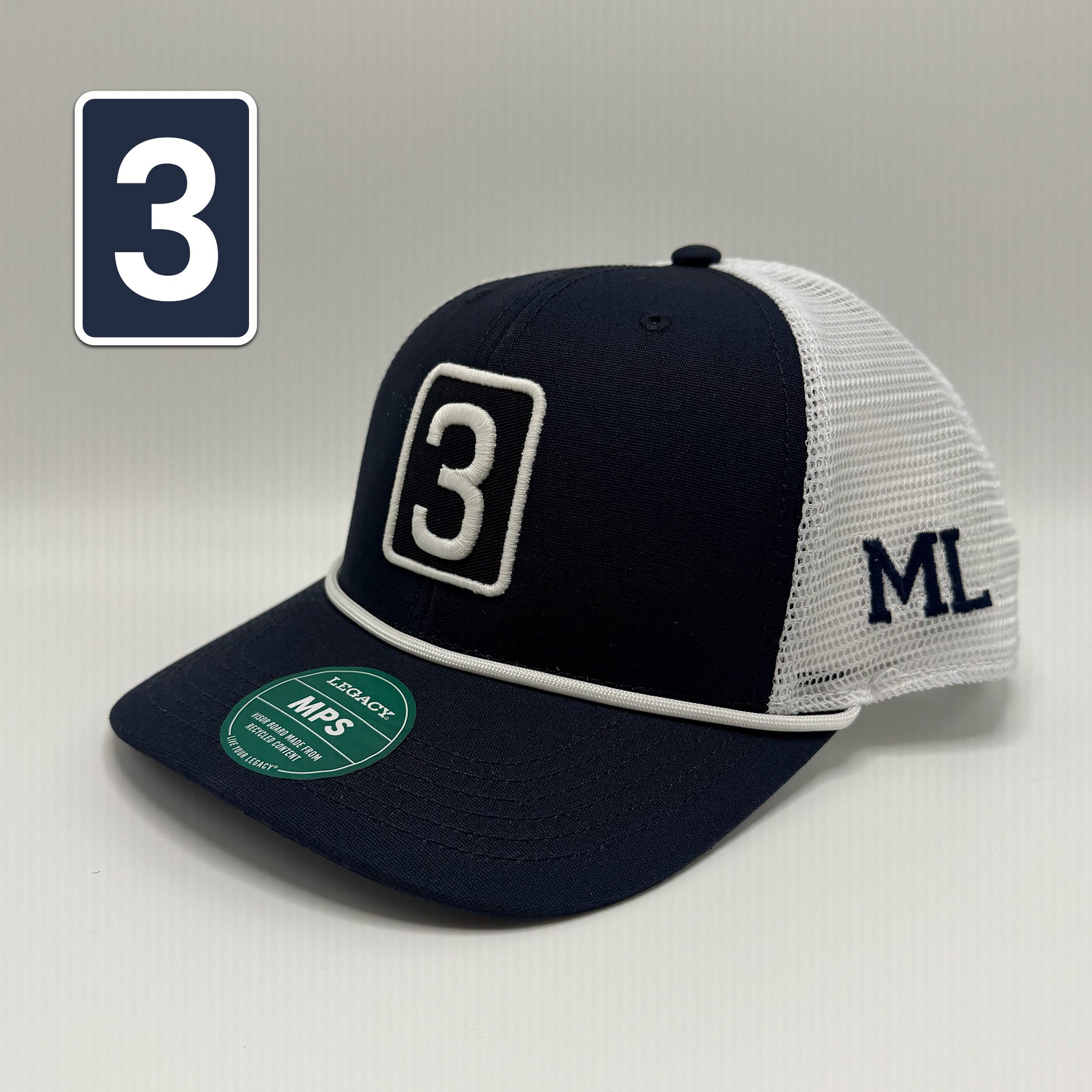 A navy blue and white trucker cap with a white mesh back, featuring a large white '3' on the front panel and 'ML' embroidered on the side. A green NFA sticker is visible on the brim, and a navy blue square graphic with a white '3' is overlaid in the top-left corner.